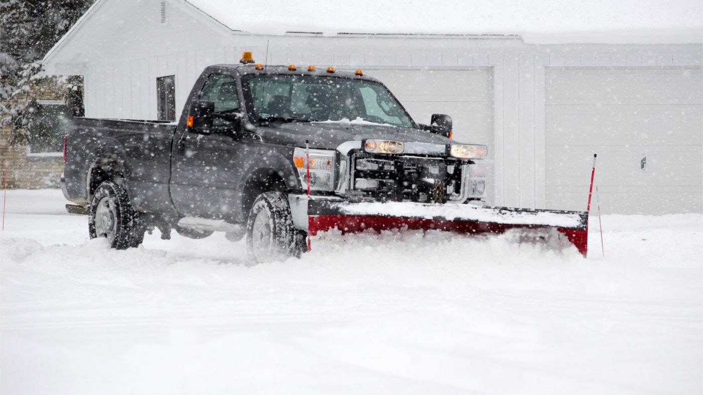 snow removal with snow plow truck